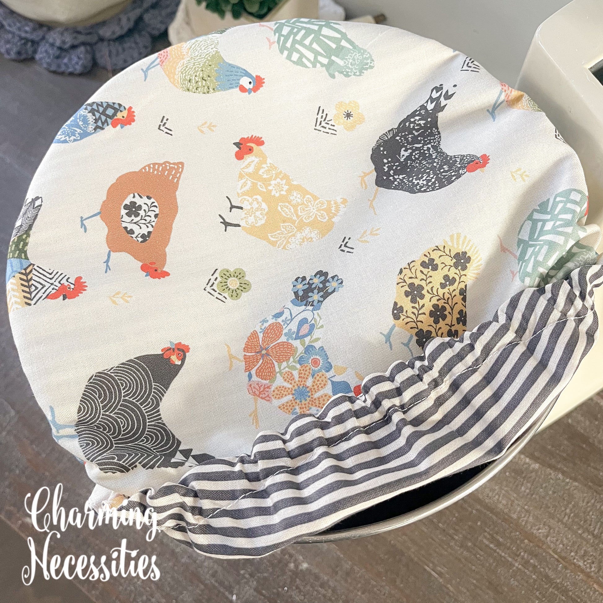 Fabric bowl cover with chicken pattern and striped interior